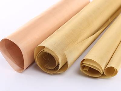 Three rolls of copper mosquito netting on the white background.