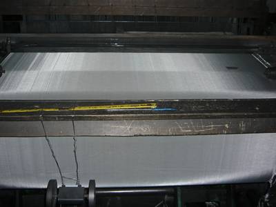 A machine is producing stainless steel 316 screen.