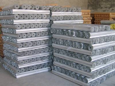 Several rolls of stainless steel 316 screen with different package in the warehouse.