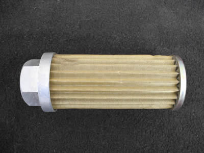 There is a brass pleated candle filter element with stainless steel edges.