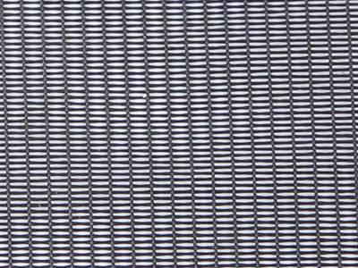 A piece of oblong mesh dust screen on the white background.
