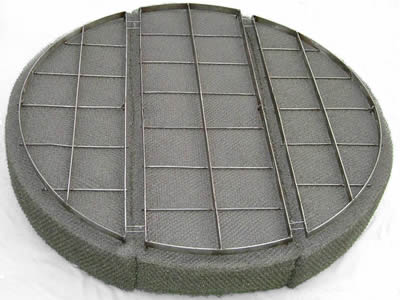 There is a demister pad made of incoloy 800 wire mesh.