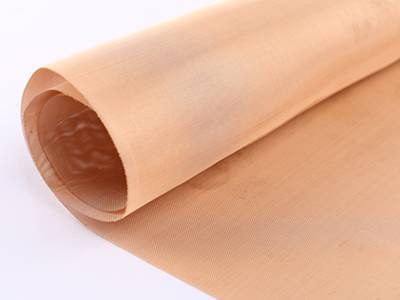 A roll of copper insect screen on the white background.