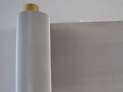 There is a molybdenum wire fine cloth roll with silver white surface.
