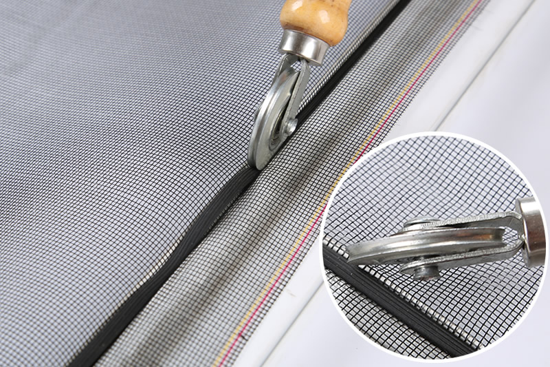 A worker is pushing splines into channel and a detail of concave ends of spline roller.