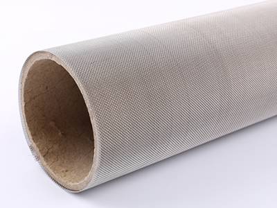 A roll of stainless steel mesh on the white background.
