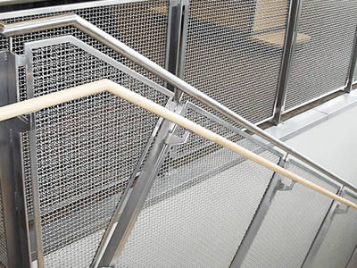 UNS32750 super duplex stainless steel wire meshes are installed on the stair railing as the infill panels.